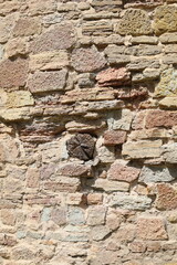 Obraz premium The texture of the destroyed brickwork of the Middle Ages. Preserved fortress walls.