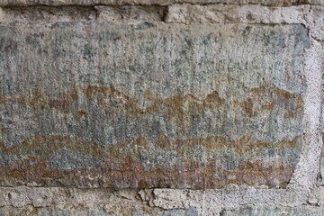 Fototapeta premium The texture of the destroyed brickwork of the Middle Ages. Preserved fortress walls.
