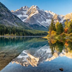 Crystal-Clear Lake at the Base of Towering Snow-Capped Mountains, Reflecting the Majestic Peaks and Vibrant Colors of the Surrounding Trees in the Early Morning Light
