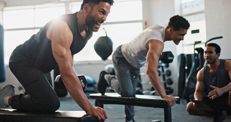 Fitness, personal trainer and men in gym with weights for bodybuilding training, exercise and...