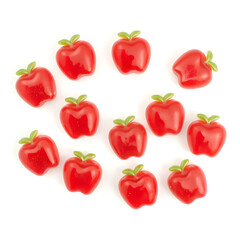 A bright red and green apple-shaped jelly candy with realistic details, isolated on white