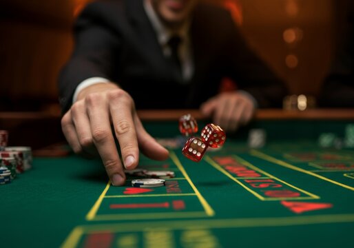 Hand throwing dice on casino craps table with poker chips in background
