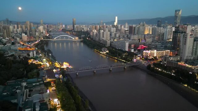 LANZHOU, CHINA- The aerial cityscape of  downtown and yellow river in Gansu province, Lanzhou city. The must landmark to visit of tourists.