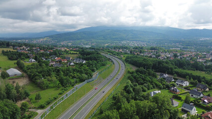 Fototapeta premium Countryside highway with mountain and cloudy sky