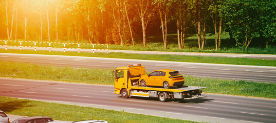 Vehicle transport on highway flatbed truck