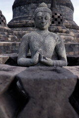 Borobudur, 9th-century Mahayana Buddhist temple. UNESCO World Heritage.  Stone Buddha statue.  Java. Indonesia.