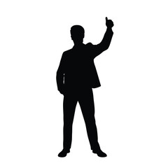 A man in a suit is standing in front of a white background. He is wearing black shoes and a black jacket