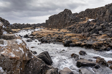 Obraz premium Oxararfoss waterfall in winter, Thingvellir National Park, Iceland