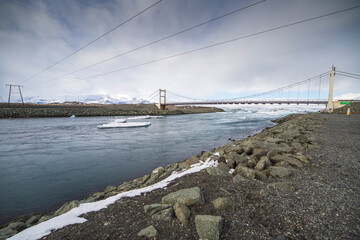 Icebergs in Jokulsarlon Glacier Lagoon in south Iceland with Vatnajokull glacier in the background