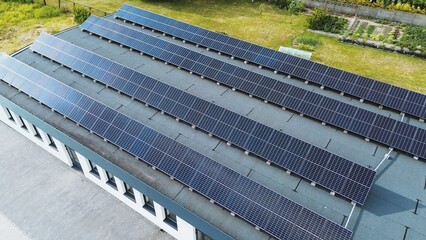 Aerial view of an industrial production facility equipped with a dedicated solar power plant