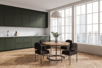 Modern kitchen with green cabinets and a wooden table near large windows in a bright room. 3D Rendering