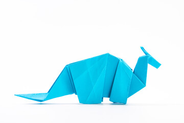 Paper dinosaur on white background. paper crafts. origami dinosaur. origami art. © Denis