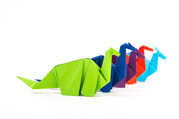 Paper dinosaur on white background. paper crafts. origami dinosaur. origami art. © Denis