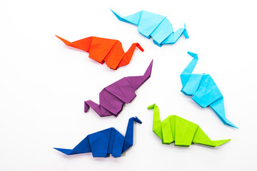 Paper dinosaur on white background. paper crafts. origami dinosaur. origami art. © Denis