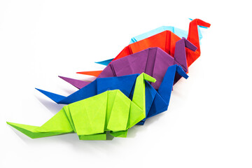Paper dinosaur on white background. paper crafts. origami dinosaur. origami art. © Denis