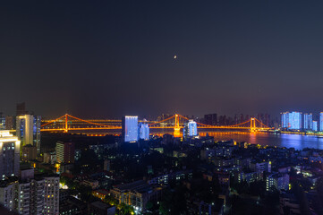 Obraz premium Night view of the landmark city on the two rivers and four banks of Wuhan, China