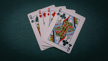 playing cards isolated four queens close-up