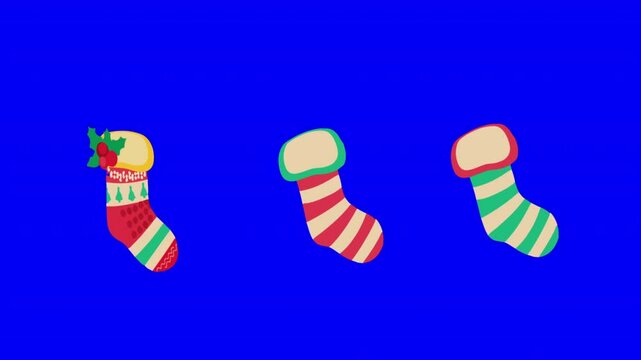 Christmas socks stockings set in various traditional colorful ornaments on blue screen background. rotation and looping animation