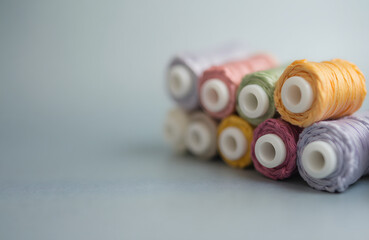 Vibrant Thread Spools in Rainbow Colors for Craft and Creation