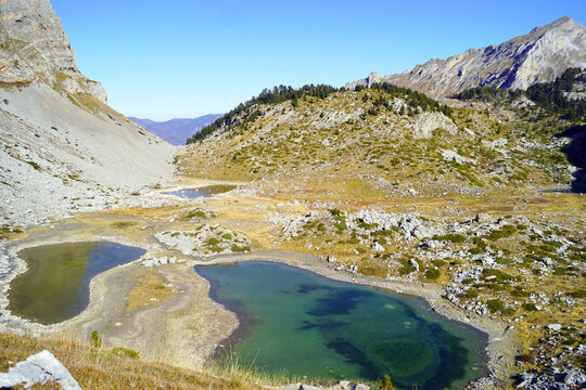 Natural beauty in Albania: valley with mountain lakes in Prokletije National Park (Buni i Jezerces). Landscape with small lakes with bright clear water, surrounded by mountain slopes