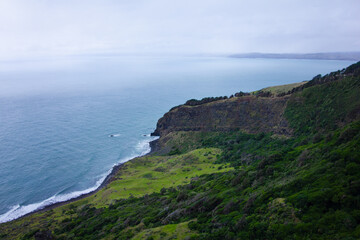 Fototapeta premium Coastal Cliffs and Waves Enjoying a Serene Ocean View Amidst Natures Beauty and Serenity. Te Toto Gorge, Raglan, New Zealand