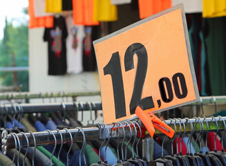 clothes and Price tag with 12 text on a market stall item