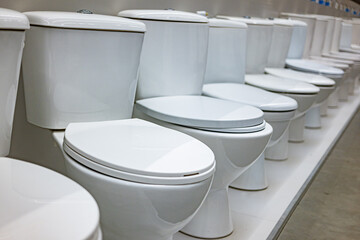 Flush toilets put up for sale in a store