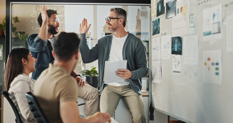 Mentor, high five and brainstorming with business people in meeting for coding workshop, cyber...