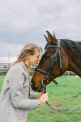 Obraz premium Beautiful woman with horse in countryside.