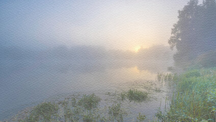 Foggy morning with a sun rising over a lake