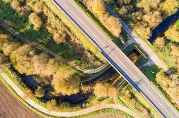 top view with drone of a bridge on a secondary road over a river, aerial photography
