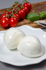Tasty italian food, fresh white buffalo mozzarella soft cheese balls from Campania close up
