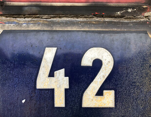 Blue sign that says 42