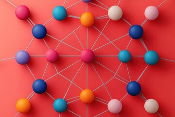 Fototapeta premium A vibrant network of colorful spheres interconnected by threads on a red background, symbolizing collaboration and connectivity.