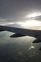 Fototapeta premium Airplane wing and clouds, taken on an airplane photo