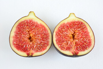 two figs with the inside of them showing the inside of the fruit