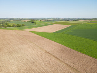 Naklejka premium View from above agriculture fields on a sunny day in spring 