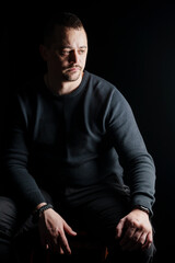 Portrait of a Contemplative Man in Low Light