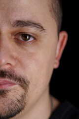 Fototapeta premium Close-up Portrait of a Man with Facial Hair and Intense Gaze