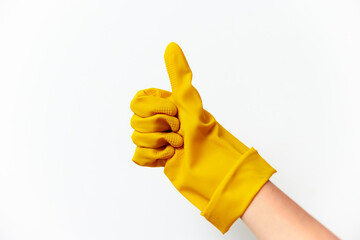 Person in yellow rubber glove giving thumbs up on white background
