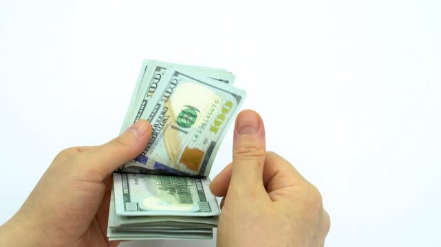 Women's hands counting $100 bills