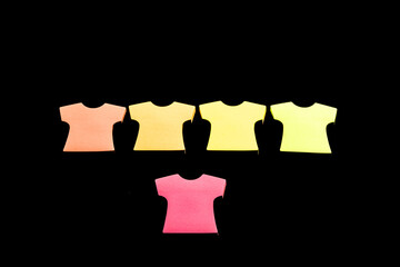 Five blank sticky note pads in the shape of T-shirts, arranged in a row with colors in salmon,...