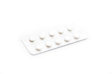 tablets in silver packaging on a white background