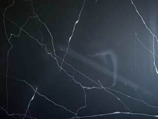 Marbled textured black chalkboard background for design projects, backdrop, black