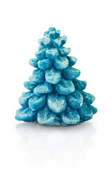 Green christmas tree in winter made of wax isolated on white background with clipping path. Design element.