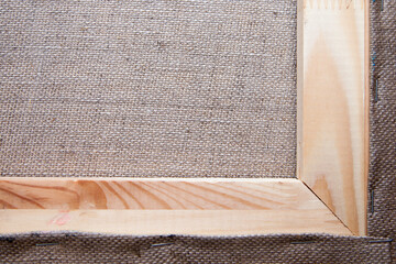 wooden corner of the stretcher with stretched canvas
