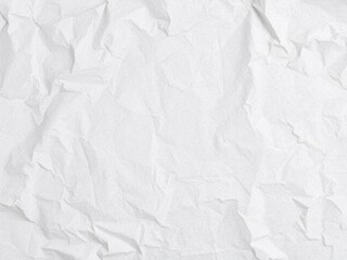 Obraz premium Crumpled white paper with soft shadows on a wooden surface, texture, flat lay, close-up