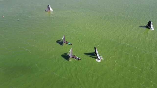 Traditional, flat-bottomed Frisian sailing ships in a yearly competition on the Ijsselmeer, The Netherlands