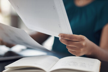 Woman, hands and review paper in office, proofreading and editing pages of novel for publication....