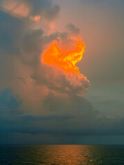 Lightning in a thunderstorm at sunset over the Caribbean Sea gives a dramatic reminder of the power of nature
